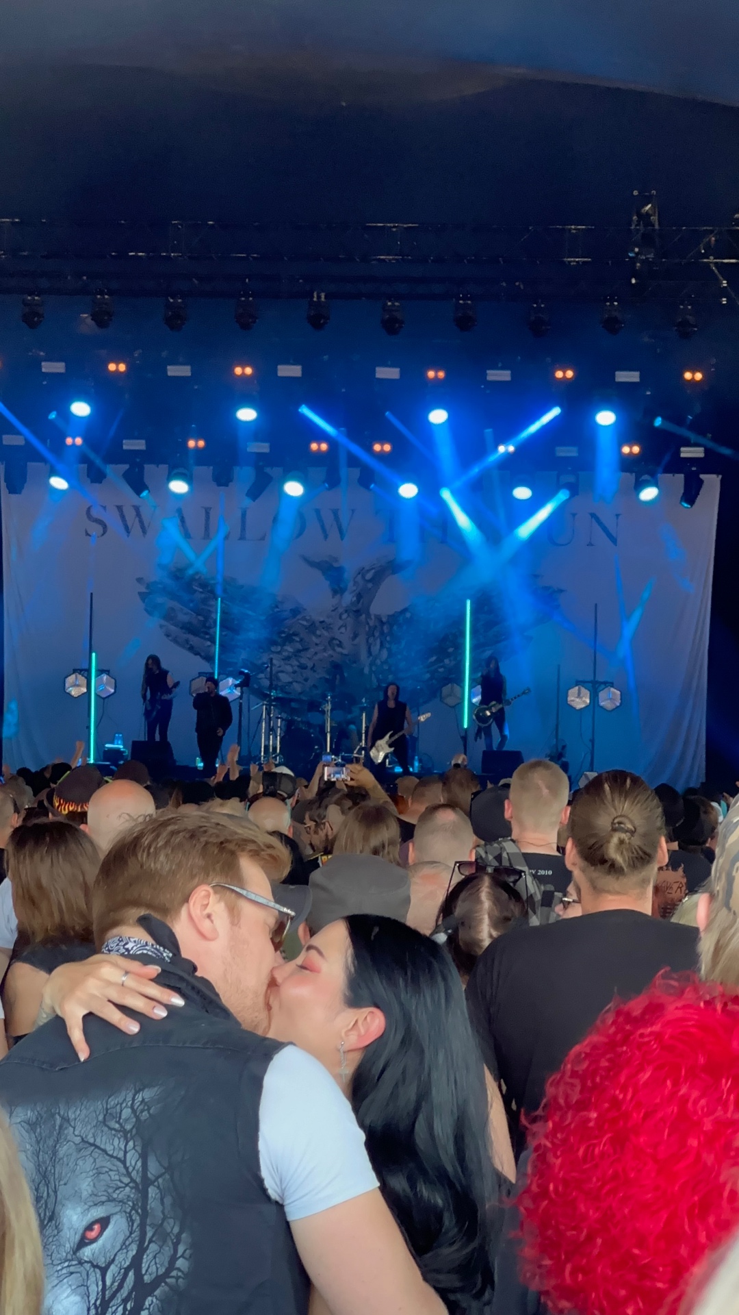 Swallow the Sun performing at Tuska Festival 2026 under deep blue stage lights in Helsinki