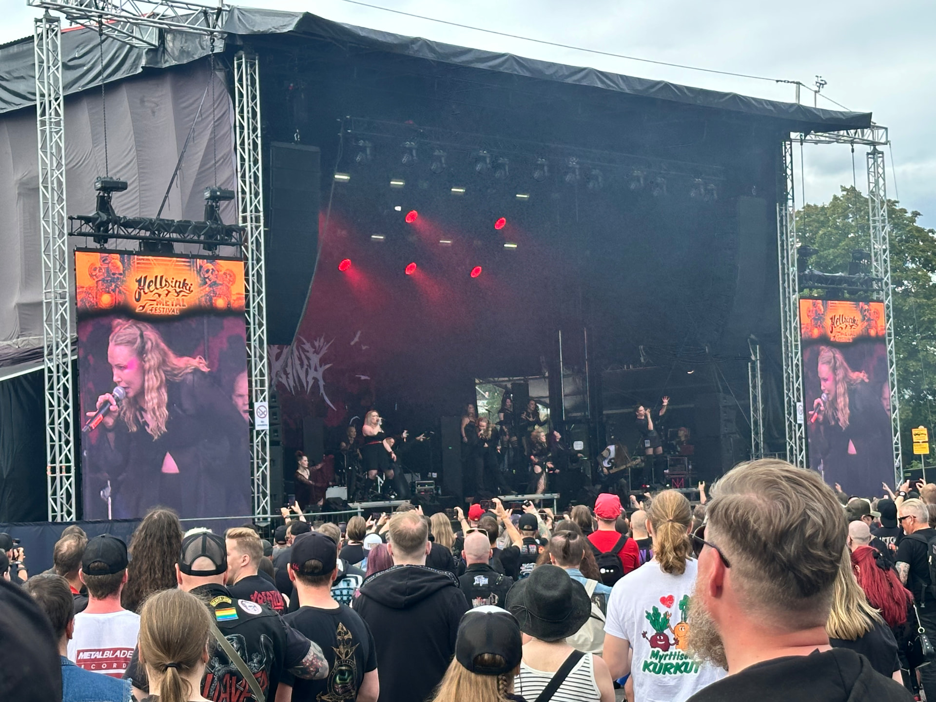 Ikinä performing on the Hellsinki Metal Festival 2026 stage with red lighting and a full stage production