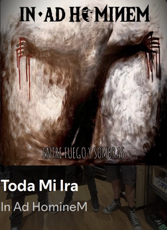 In Ad HomineM — Entre Fuego y Sombras album cover artwork