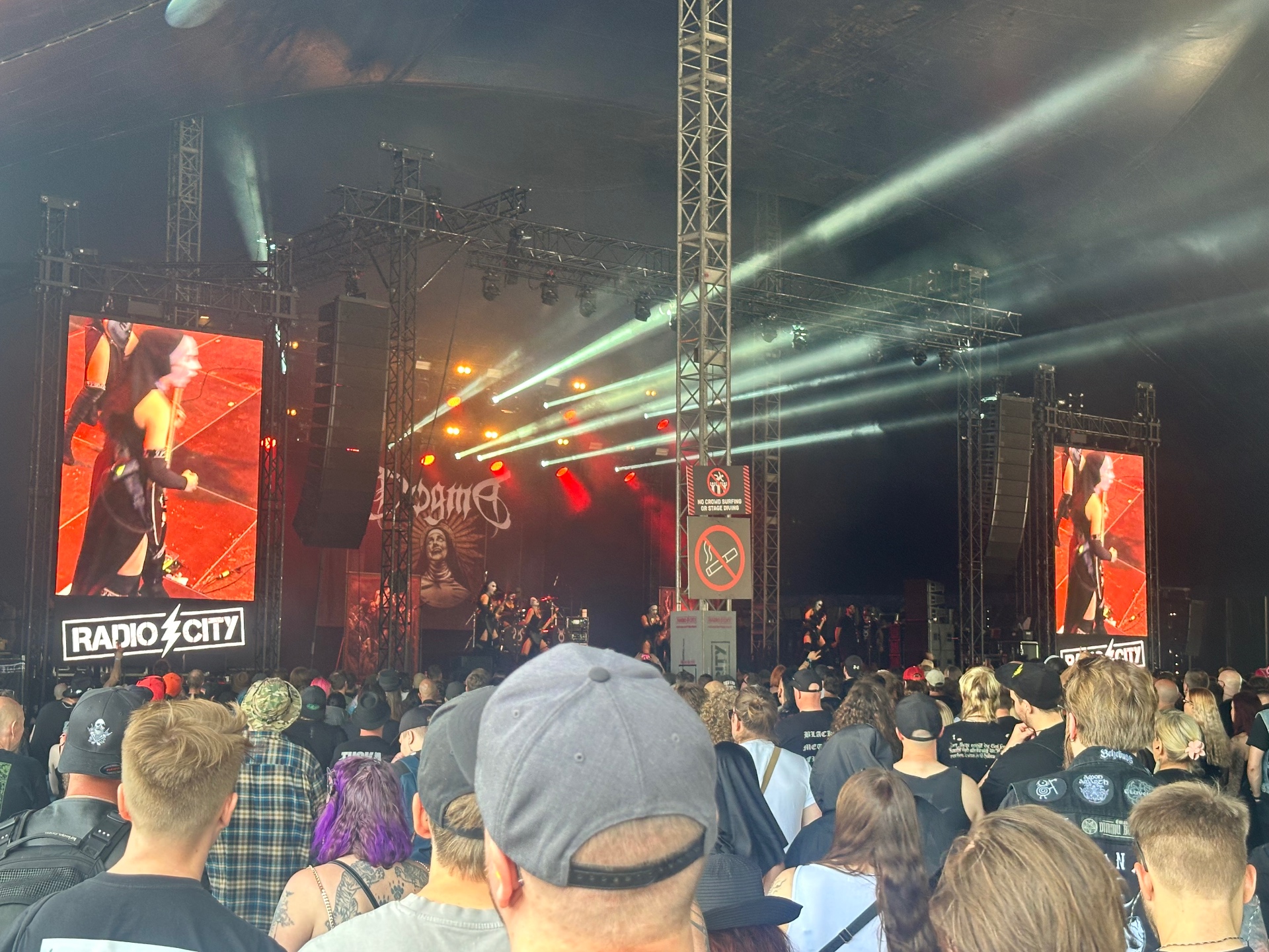 Dogma performing live at Tuska Festival 2026 with red lights and a packed crowd