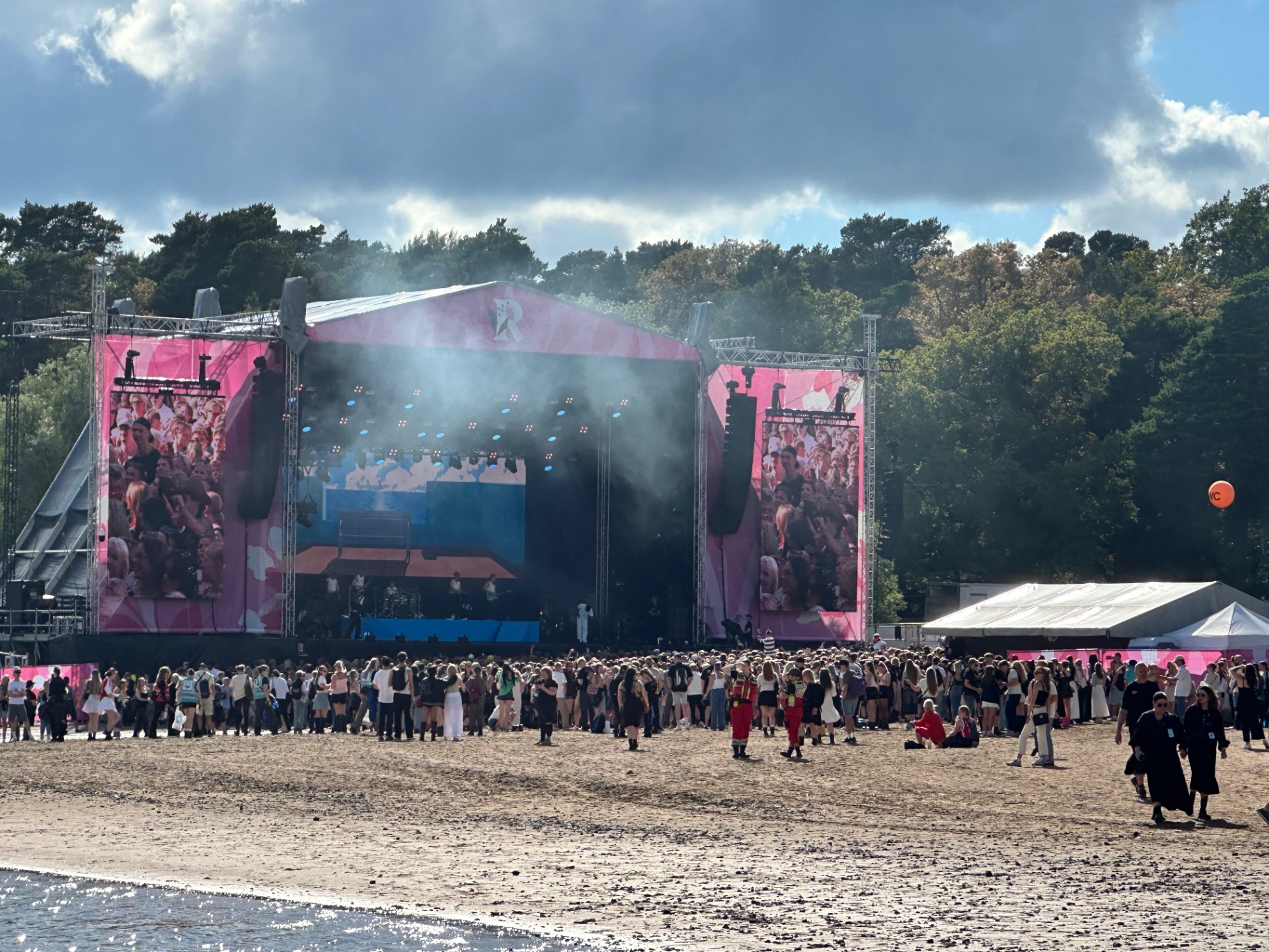 Ruisrock 2026 main stage on the beach at Ruissalo with crowd and pine trees
