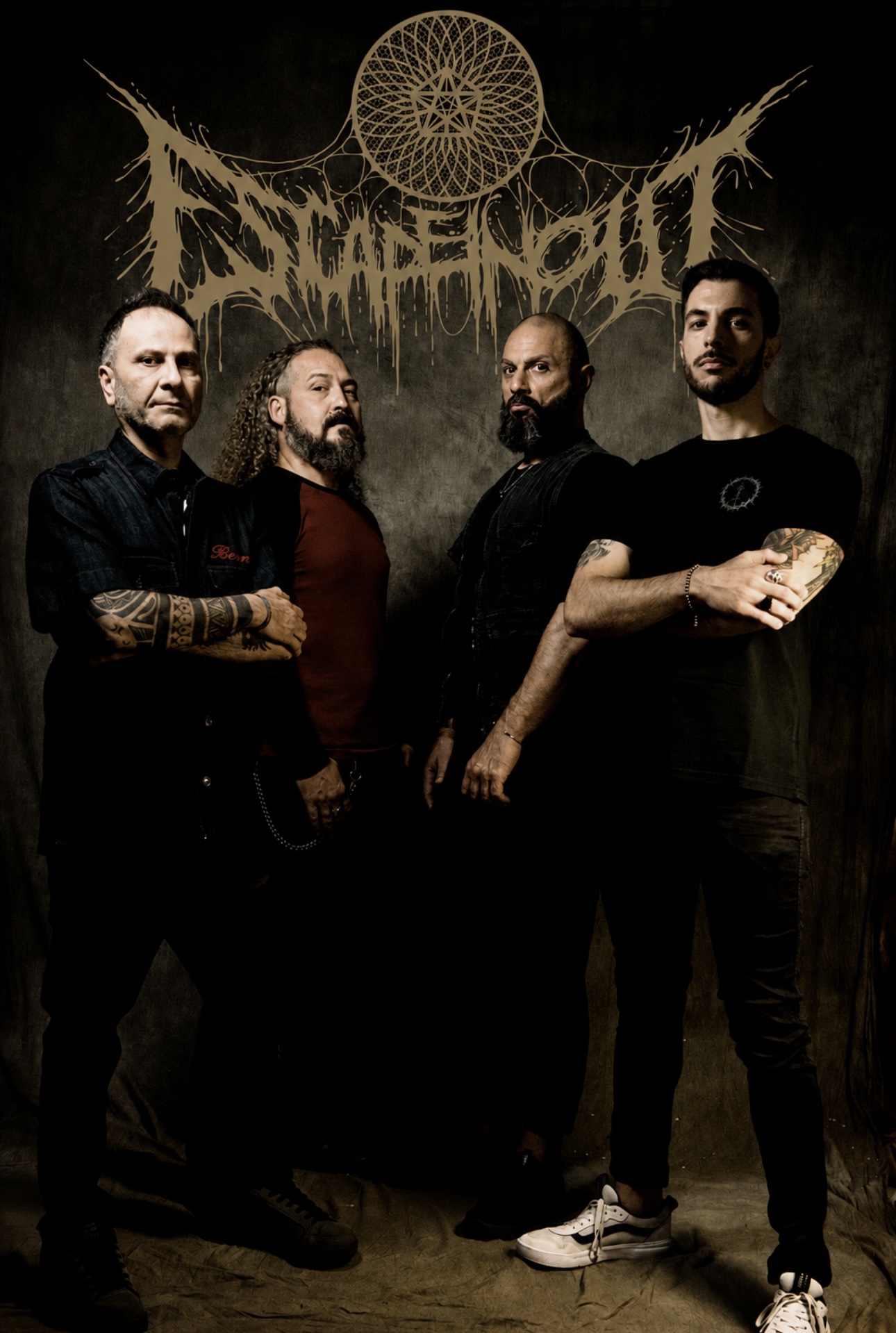 Escapeinout band photo — four members standing beneath the band's logo backdrop