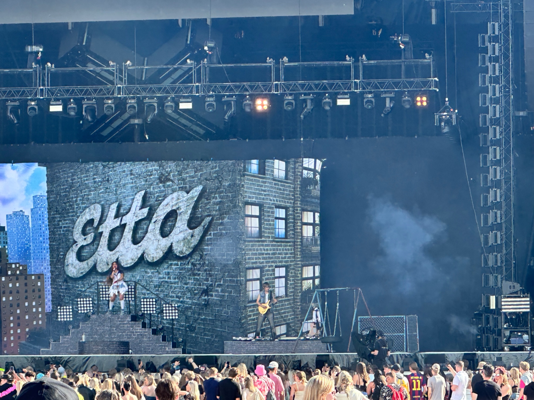 Etta performing on Ruisrock 2026 main stage with NYC brick-wall backdrop